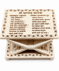 Decorative wooden stand with a carved plate displaying Devanagari text and floral borders.