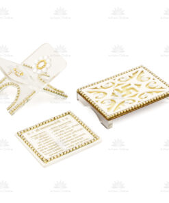 White and gold ornate keepsake boxes with beaded borders and floral carvings on a white background; one box open showing a flower motif