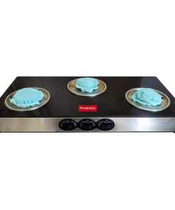 Three-burner flat-top griddle with blue cloth covers on each burner and a red brand badge on the black surface.