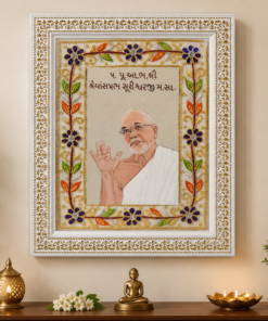 Ornate framed portrait of a spiritual teacher in white robes, on a home altar with floral embroidery frame, plants, and lit lamps nearby.