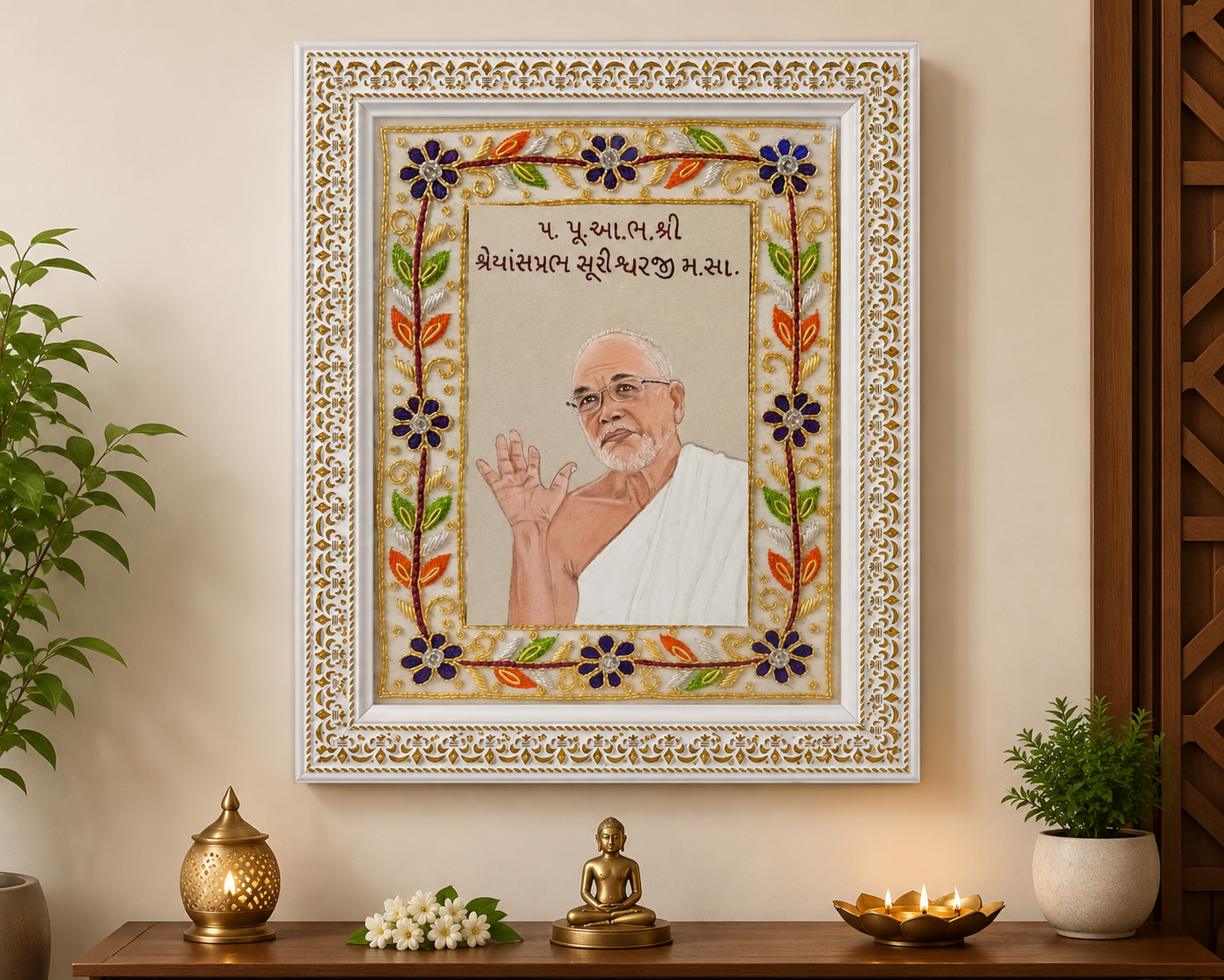 Ornate framed portrait of a spiritual teacher in white robes, on a home altar with floral embroidery frame, plants, and lit lamps nearby.