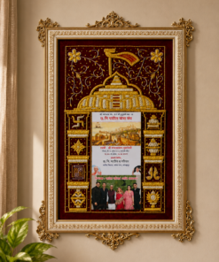 Ornate gold-framed wall plaque with a burgundy backdrop and a temple illustration poster in the center, plus a group photo at the bottom.