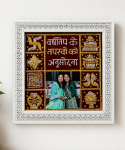 Ornate white frame enclosing a collage with gold-embellished red panels and a central photo of two women in traditional outfits.