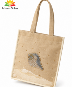 Beige tote bag with two handles and a decorative shell appliqué on the front.