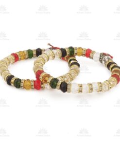 Three gold-toned beaded bracelets with square gems in red, green, black, white, and yellow, arranged in a loop for display.