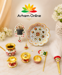 Colorful traditional Indian ceremonial items arranged on a light marble surface with an Arham Online logo above.