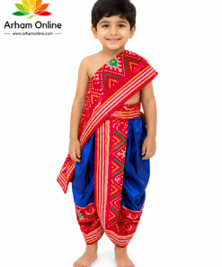 Smiling young boy in a red and blue traditional Indian outfit standing barefoot; Arham Online logo in the top left.