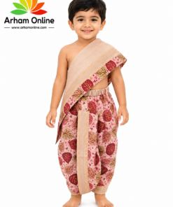 Smiling boy in beige and pink traditional Indian outfit with a leaf pattern, Arham Online logo on the left.